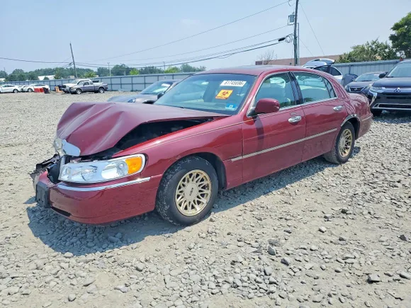 1999 Lincoln Town Car Signature, VIN 1LNHM82W8XY675402 — Biohazard / chemical