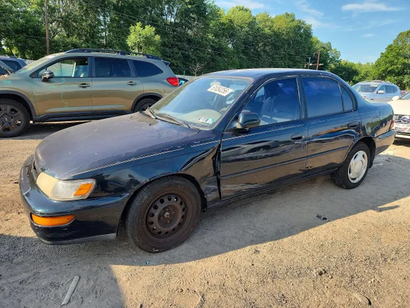 1997 Toyota Corolla DX, VIN 1NXBB02E6VZ599283 — Side