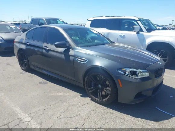 2016 BMW M5, VIN WBSFV9C53GD595591 — Side