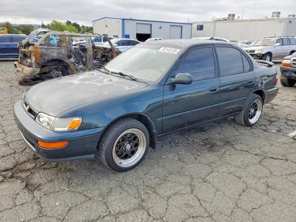 1997 Toyota Corolla DX, VIN 1NXBB02E5VZ588419 — Rear end