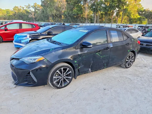 2018 Toyota Corolla XLE, VIN 5YFBURHE5JP827615 — Side