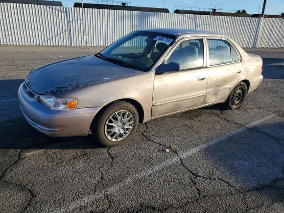 2000 Toyota Corolla CE, VIN 1NXBR12E7YZ405172 — Side