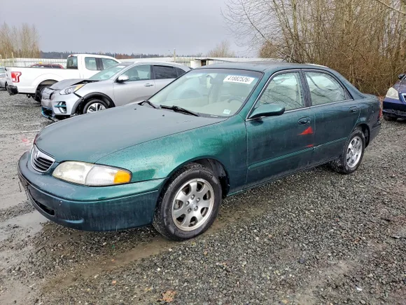 1998 Mazda 626 DX, VIN 1YVGF22C8W5752888 — Side
